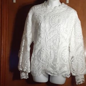 White lace blouse with feminine puff sleeves